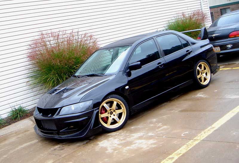 Anyone have BLACK evo with GOLD rims EvolutionM