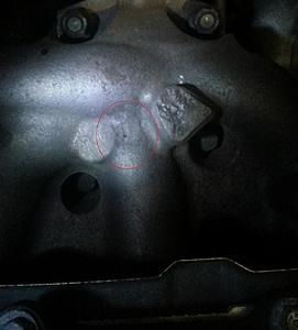 Lots of knock all of a sudden-cracked-manifold.jpg